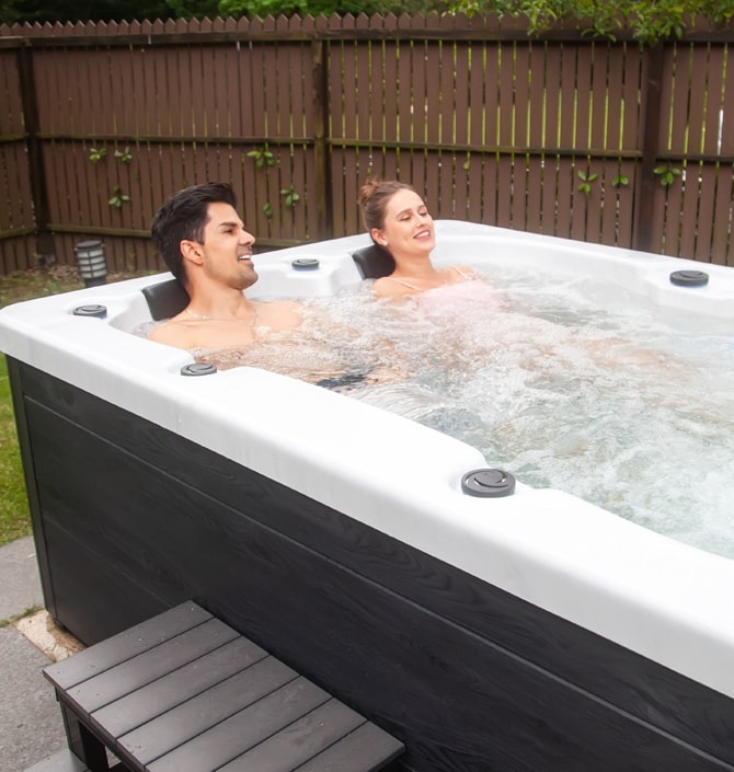 couple in a small hot tub