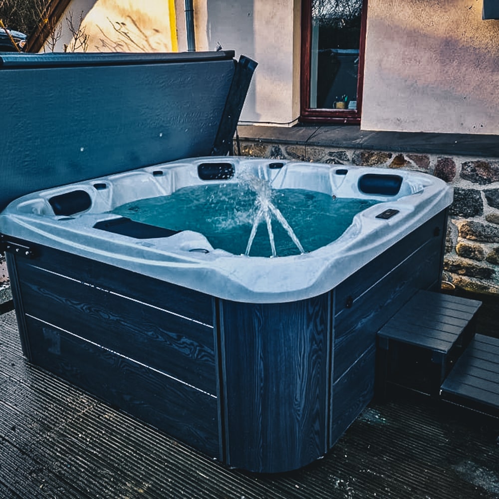 Retreat Plus plug and play hot tub in a garden